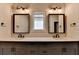 Bathroom featuring double vanity with black fixtures, and natural lighting from a central window at 3415 Crop Corner Rd, Suwanee, GA 30024
