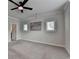 Spacious bedroom featuring neutral colors, large windows and ceiling fan with light at 3415 Crop Corner Rd, Suwanee, GA 30024