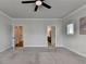 Bright bedroom with ensuite bathroom entrance, ceiling fan and carpeted flooring at 3415 Crop Corner Rd, Suwanee, GA 30024