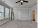 Expansive bedroom filled with natural light, featuring a full-length mirror and grey carpet at 3415 Crop Corner Rd, Suwanee, GA 30024