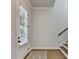 Bright entryway features hardwood floors, staircase, and large window with modern blinds at 3415 Crop Corner Rd, Suwanee, GA 30024