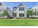 Charming two-story home with white siding, black framed windows and well-manicured lawn at 3415 Crop Corner Rd, Suwanee, GA 30024