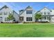 Charming two-story home with white siding, black framed windows and well-manicured lawn at 3415 Crop Corner Rd, Suwanee, GA 30024