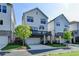 Beautiful home exterior featuring a private balcony, a two-car garage, and manicured lawn at 3415 Crop Corner Rd, Suwanee, GA 30024