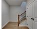 Inviting hallway with wood floors, stairs and closet at 3415 Crop Corner Rd, Suwanee, GA 30024