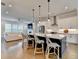Bright, modern kitchen with an island, stainless steel appliances, and a view into the living space at 3415 Crop Corner Rd, Suwanee, GA 30024