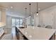 Kitchen with island seating, stainless steel fixtures, and abundant natural light at 3415 Crop Corner Rd, Suwanee, GA 30024