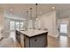 Open concept kitchen with modern island, pendant lighting, and stainless steel appliances at 3415 Crop Corner Rd, Suwanee, GA 30024