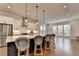 Spacious kitchen featuring a large island with pendant lighting and bar stool seating at 3415 Crop Corner Rd, Suwanee, GA 30024
