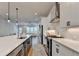 Gourmet kitchen featuring an island with seating, stainless steel appliances, and an open layout at 3415 Crop Corner Rd, Suwanee, GA 30024