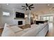 Well-lit living room boasts an open concept with a fireplace and modern kitchen view at 3415 Crop Corner Rd, Suwanee, GA 30024
