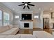 Inviting living room with a fireplace, large sectional sofa, and hardwood flooring at 3415 Crop Corner Rd, Suwanee, GA 30024