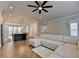 Spacious open-concept living room leading to the kitchen and stairway, bright and inviting at 3415 Crop Corner Rd, Suwanee, GA 30024