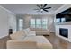 Living room with a white brick fireplace and a large, comfortable sofa at 3415 Crop Corner Rd, Suwanee, GA 30024