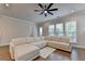 Bright living room featuring large windows and a comfortable, expansive sectional sofa at 3415 Crop Corner Rd, Suwanee, GA 30024