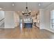 Bright living room showcasing an open layout, hardwood floors, and modern lighting at 3415 Crop Corner Rd, Suwanee, GA 30024
