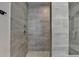 Modern shower featuring gray horizontal tiling and stylish silver shower fixture at 3415 Crop Corner Rd, Suwanee, GA 30024