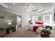 Spacious bedroom features tray ceilings, neutral paint, and ample natural light from the bright, sunny windows at 1079 Angel Ln, Powder Springs, GA 30127