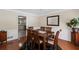 Elegant dining room featuring stylish hardwood flooring, and an adjacent kitchen at 1079 Angel Ln, Powder Springs, GA 30127