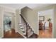 Well-lit foyer with hardwood floors and staircase access to other rooms in the home at 1079 Angel Ln, Powder Springs, GA 30127