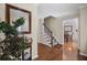 Inviting foyer with hardwood floors, stairway, mirror, and natural light at 1079 Angel Ln, Powder Springs, GA 30127