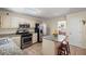 Updated kitchen with stainless steel appliances, and granite countertops at 1079 Angel Ln, Powder Springs, GA 30127