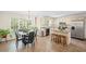 Open kitchen dining with large windows and an island, perfect for casual dining at 1079 Angel Ln, Powder Springs, GA 30127