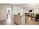 Kitchen boasts an island with seating, stainless appliances, and access to living spaces at 1079 Angel Ln, Powder Springs, GA 30127