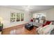 Sun-drenched living room offers views of the outdoor space, and access to the kitchen at 1079 Angel Ln, Powder Springs, GA 30127