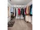 Spacious walk-in closet with custom shelving, racks, and room for plenty of storage at 1079 Angel Ln, Powder Springs, GA 30127