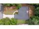 An aerial view of the home highlighting the roof and landscaped backyard at 8189 N Pine Cone N Dr, Villa Rica, GA 30180