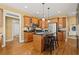 Well-lit kitchen featuring stainless steel appliances, an island with seating, and hardwood flooring at 8189 N Pine Cone N Dr, Villa Rica, GA 30180
