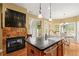 Kitchen island featuring stainless appliances, black countertops, and access to dining area at 8189 N Pine Cone N Dr, Villa Rica, GA 30180