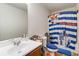 This bathroom includes a vanity with a single sink and a shower featuring a Star Wars curtain at 5622 Laurel Ridge Dr, Atlanta, GA 30344