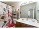 The bathroom features a double sink vanity and a shower with a Paris themed curtain at 5622 Laurel Ridge Dr, Atlanta, GA 30344