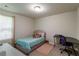 Carpeted bedroom with a twin bed, desk, and window allowing for natural light at 5622 Laurel Ridge Dr, Atlanta, GA 30344