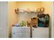 Laundry room with a washer, dryer, and shelves for storage at 5622 Laurel Ridge Dr, Atlanta, GA 30344