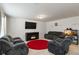 Spacious living room with comfortable seating, fireplace, and TV at 5622 Laurel Ridge Dr, Atlanta, GA 30344