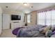 Serene bedroom with natural light, dresser, and en-suite bathroom at 5622 Laurel Ridge Dr, Atlanta, GA 30344