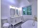 Bathroom features a double vanity, soaking tub, and modern fixtures at 2540 Rocky Springs Dr, Marietta, GA 30062