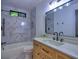 Stylish bathroom featuring marble tile, modern fixtures, and a vanity with a sleek countertop at 2540 Rocky Springs Dr, Marietta, GA 30062