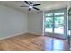 Bright bedroom featuring hardwood floors, a ceiling fan, and a large window offering a pleasant view at 2540 Rocky Springs Dr, Marietta, GA 30062