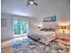 Spacious bedroom with large window, ceiling fan, and ample natural light at 2540 Rocky Springs Dr, Marietta, GA 30062
