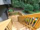 Elevated angle of stained wood deck with stairs down to the yard and a privacy fence at 2540 Rocky Springs Dr, Marietta, GA 30062