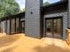 Exterior of house featuring a deck, dark siding, and access to the backyard at 2540 Rocky Springs Dr, Marietta, GA 30062