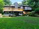 Exterior of the house showcasing a large backyard, multilevel decks, and mature trees at 2540 Rocky Springs Dr, Marietta, GA 30062