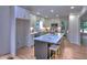 Bright kitchen featuring white cabinets, a marble island, and stainless steel appliances at 2540 Rocky Springs Dr, Marietta, GA 30062