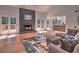 Open-concept living room featuring hardwood floors, a modern fireplace, and access to the kitchen at 2540 Rocky Springs Dr, Marietta, GA 30062
