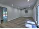 Bright living room with light wood flooring, recessed lights, and windows to the green outdoors at 2540 Rocky Springs Dr, Marietta, GA 30062