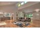 Open-concept living room with hardwood floors, a modern fireplace, and views of the kitchen and backyard at 2540 Rocky Springs Dr, Marietta, GA 30062